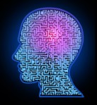 Human intelligence puzzle represented by a blue glowing maze and labyrinth in the shape of a human head representing the concept and symbol of the complexity of brain thinking and thought patterns as a challenging problem to solve by medical doctors.